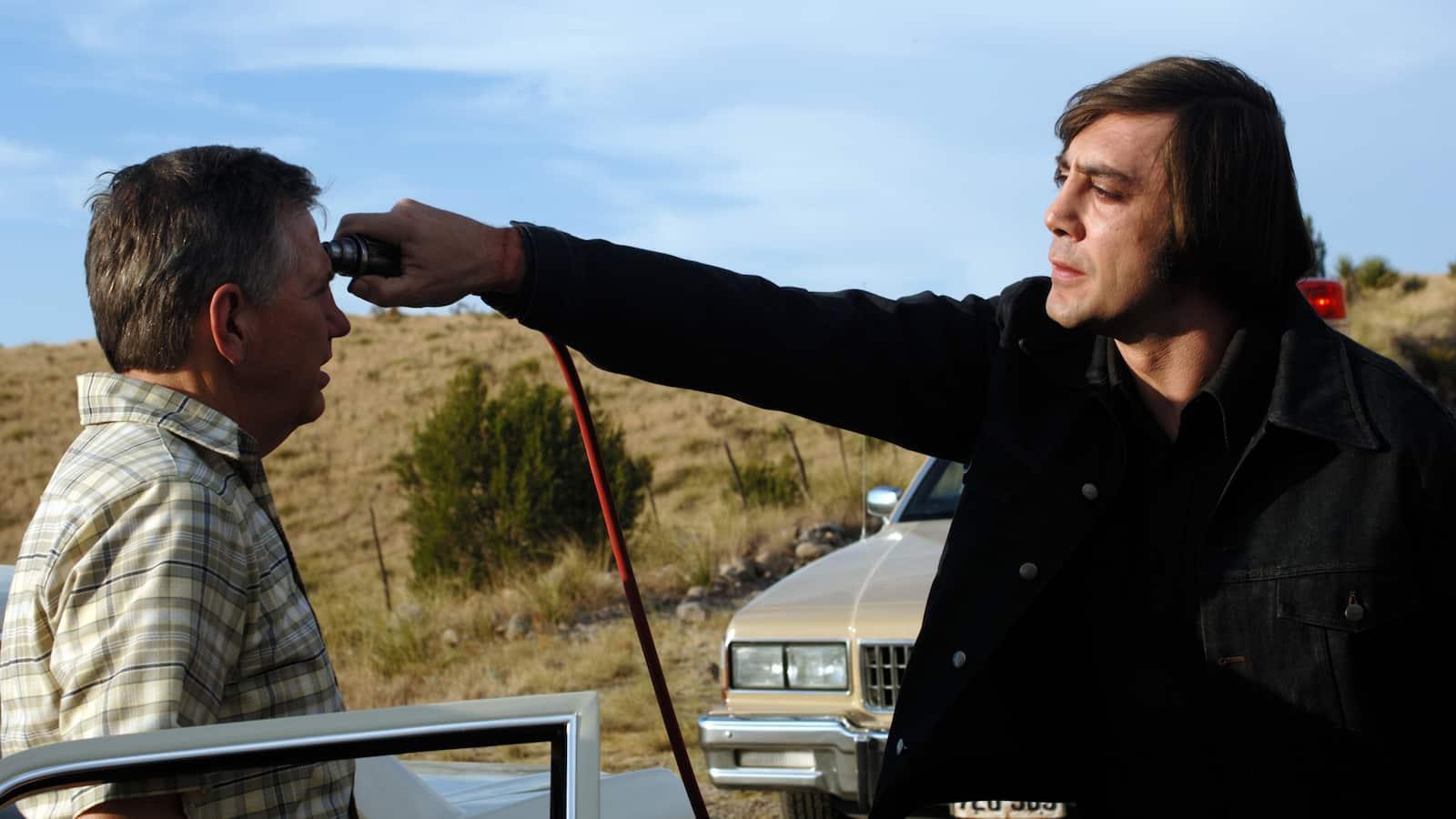 Anton Chigurh Holding Cattle Gun To Guy's Head - No Country for Old Men