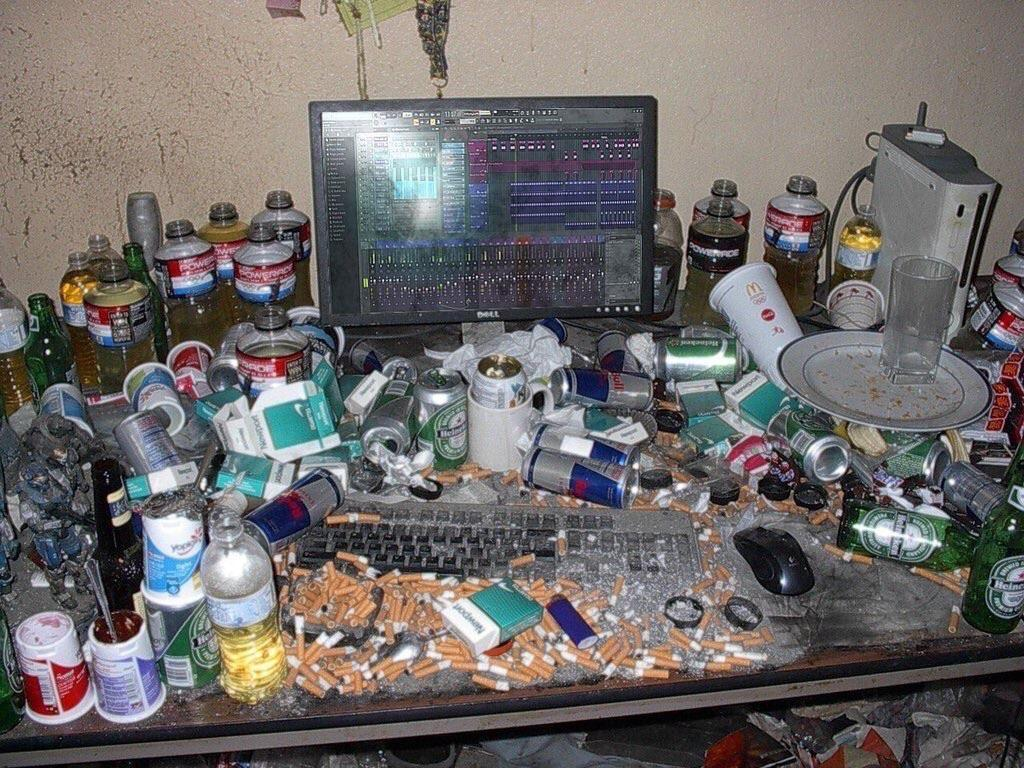 Dirty/Messy Computer Desk with Cigarettes and Trash