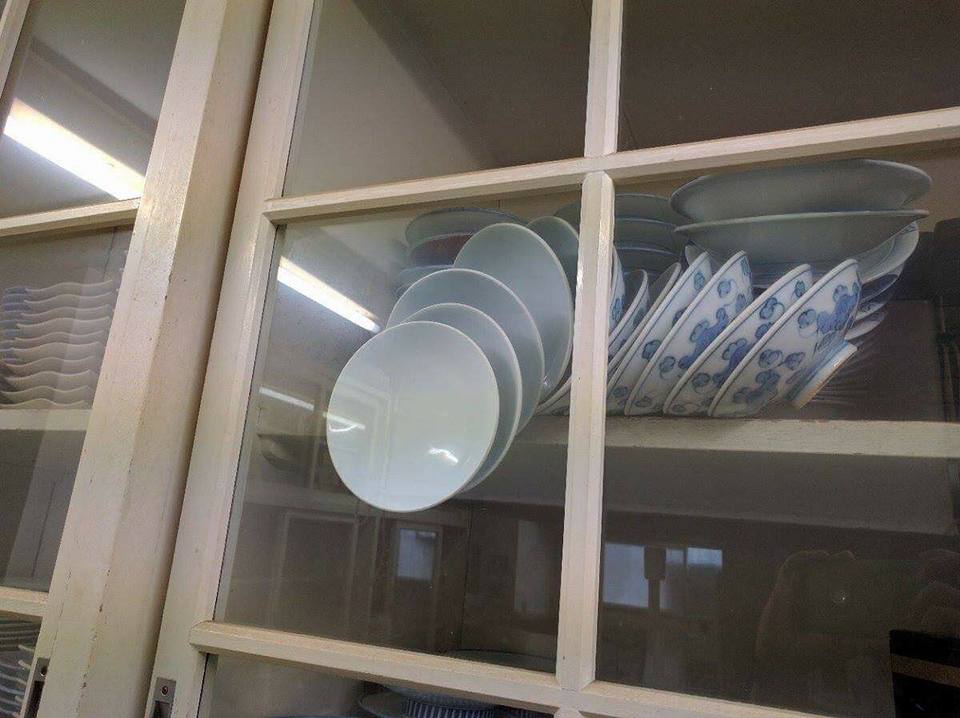 Falling Plates in Closed Cupboard