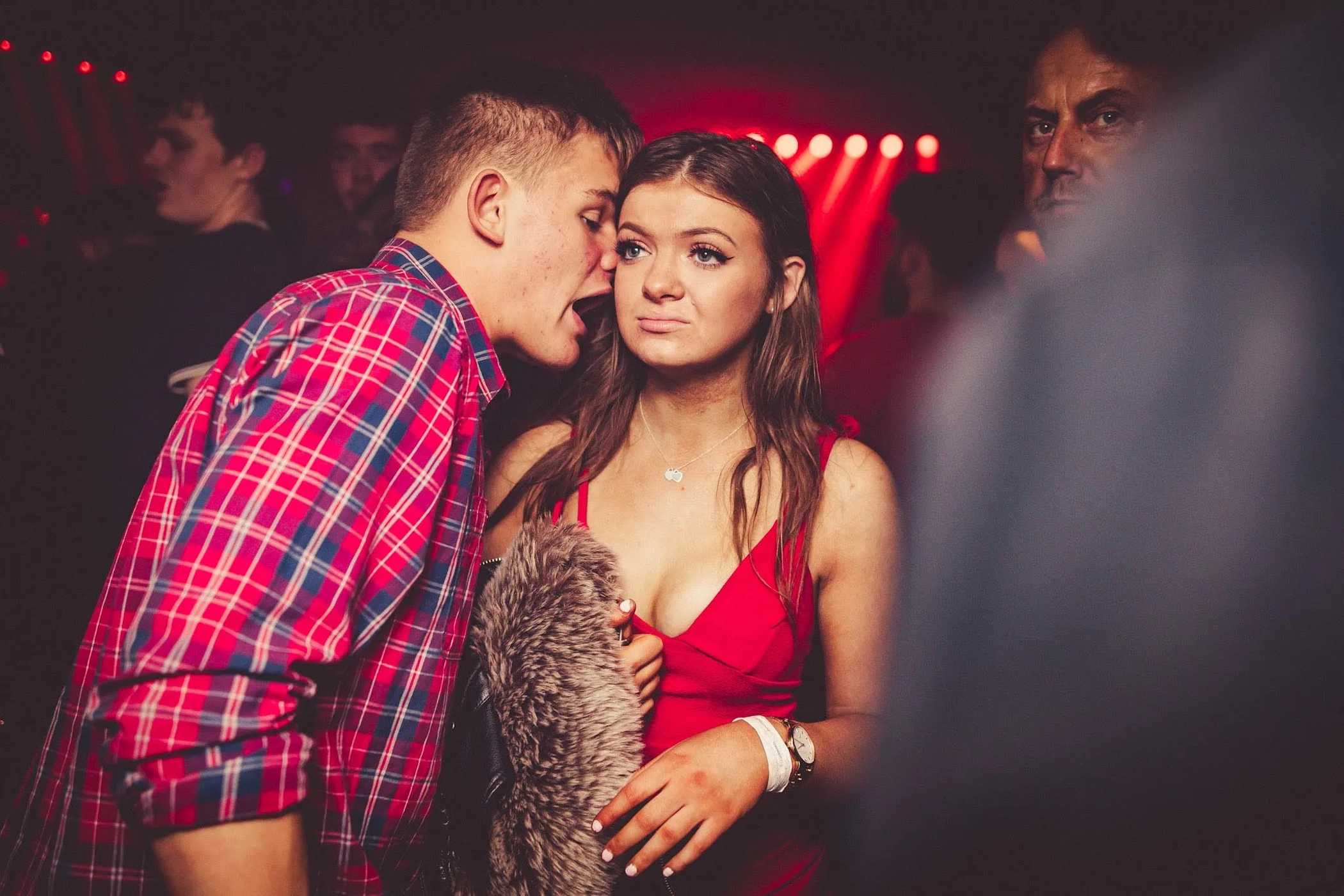 Guy Talking to Uninterested Girl at Night Club
