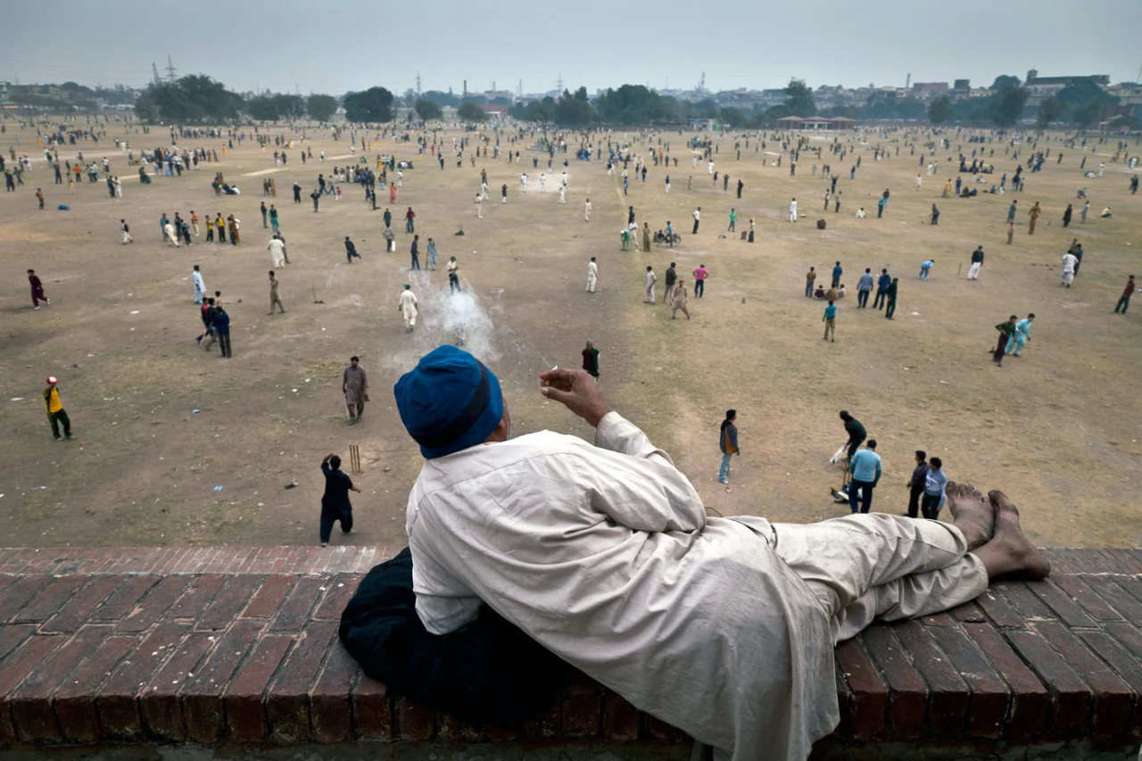 Indian Man Watches Battle While Smoking meme template variation