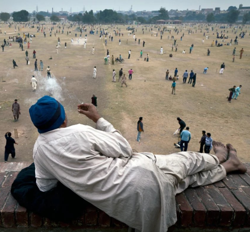 Indian Man Watches Battle While Smoking meme template variation