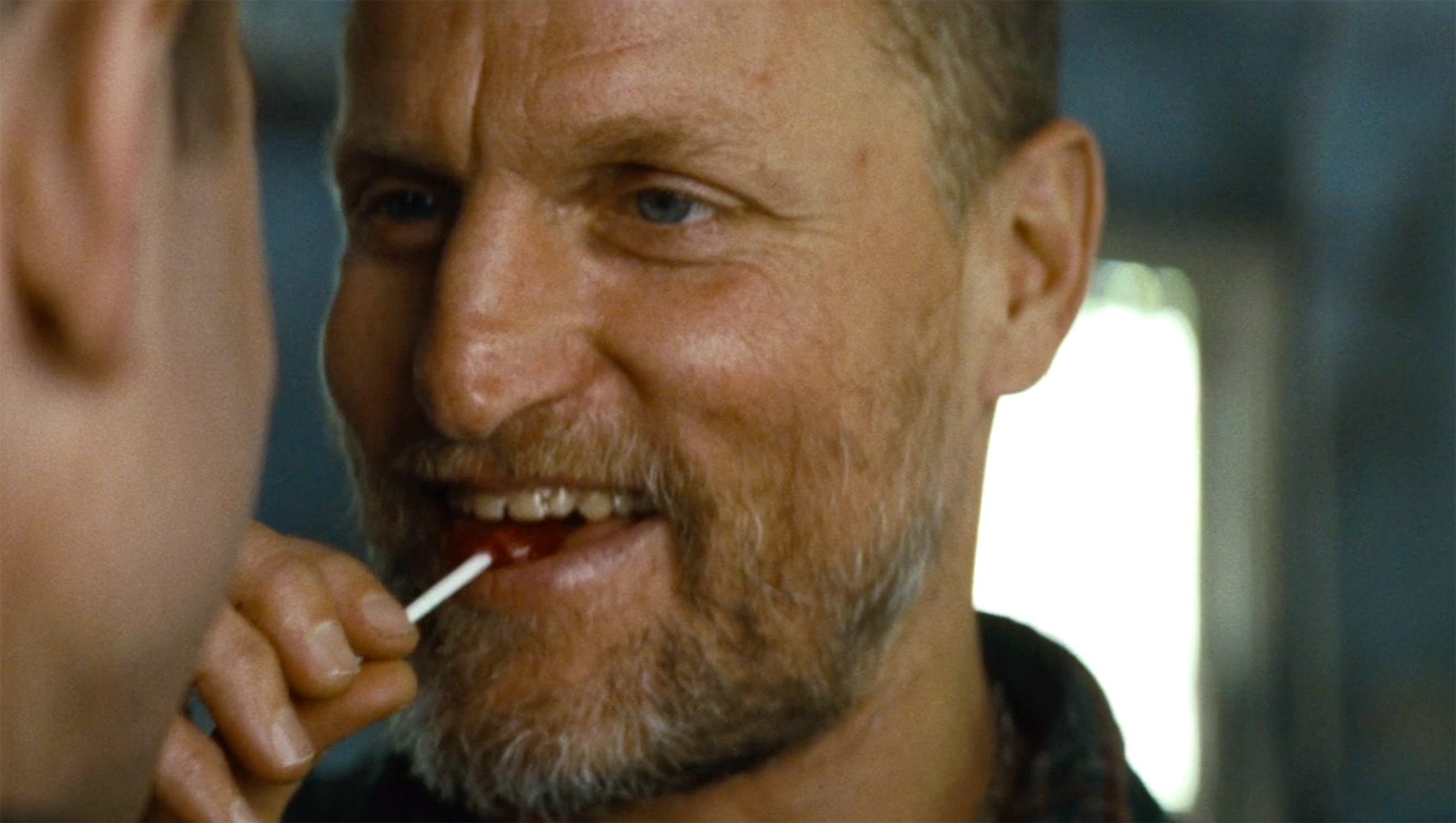 Smiling Woody Harrelson with Lollipop - Out of the Furnace meme template variation
