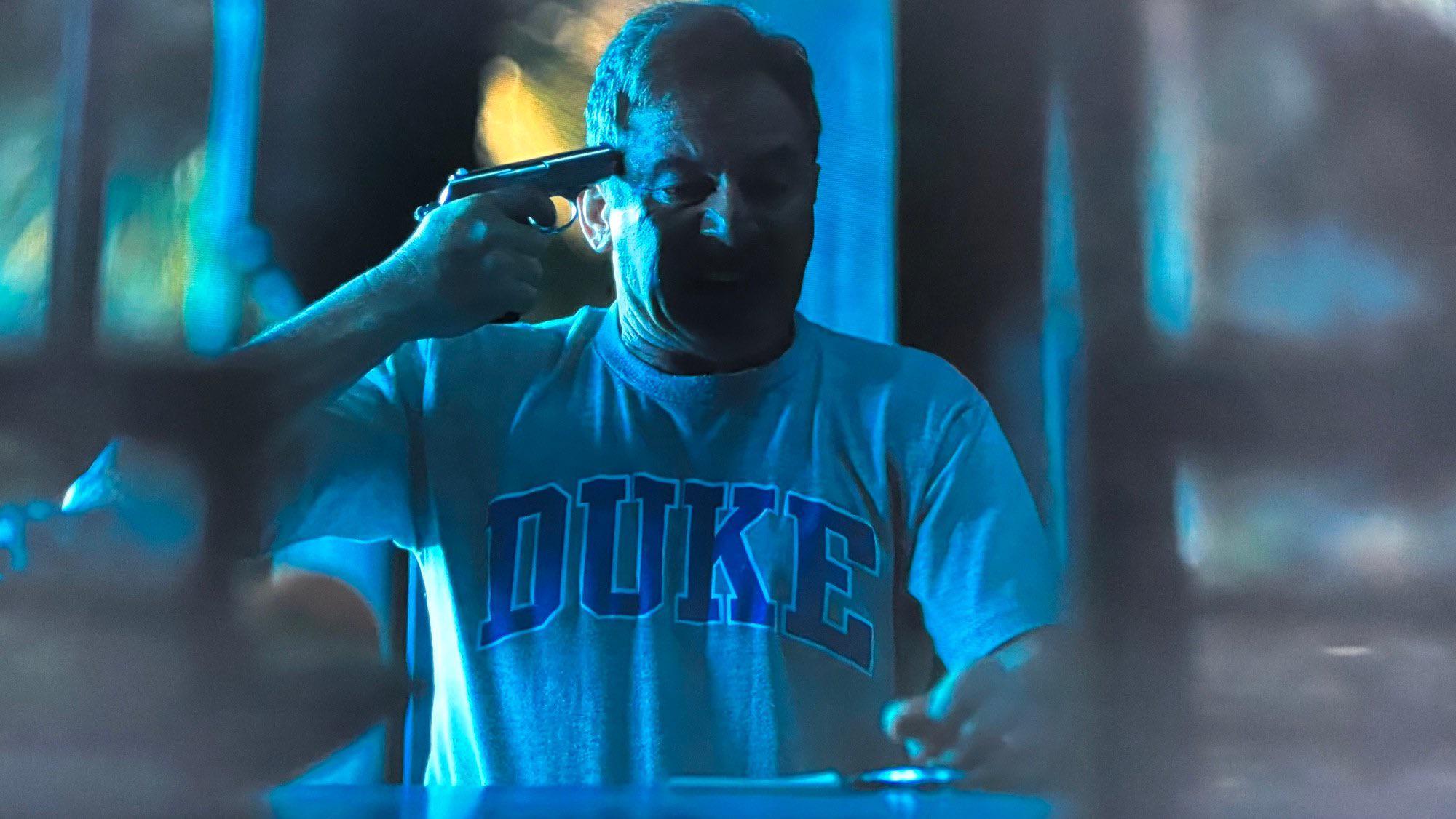 White Lotus dad with Duke shirt and gun meme template variation