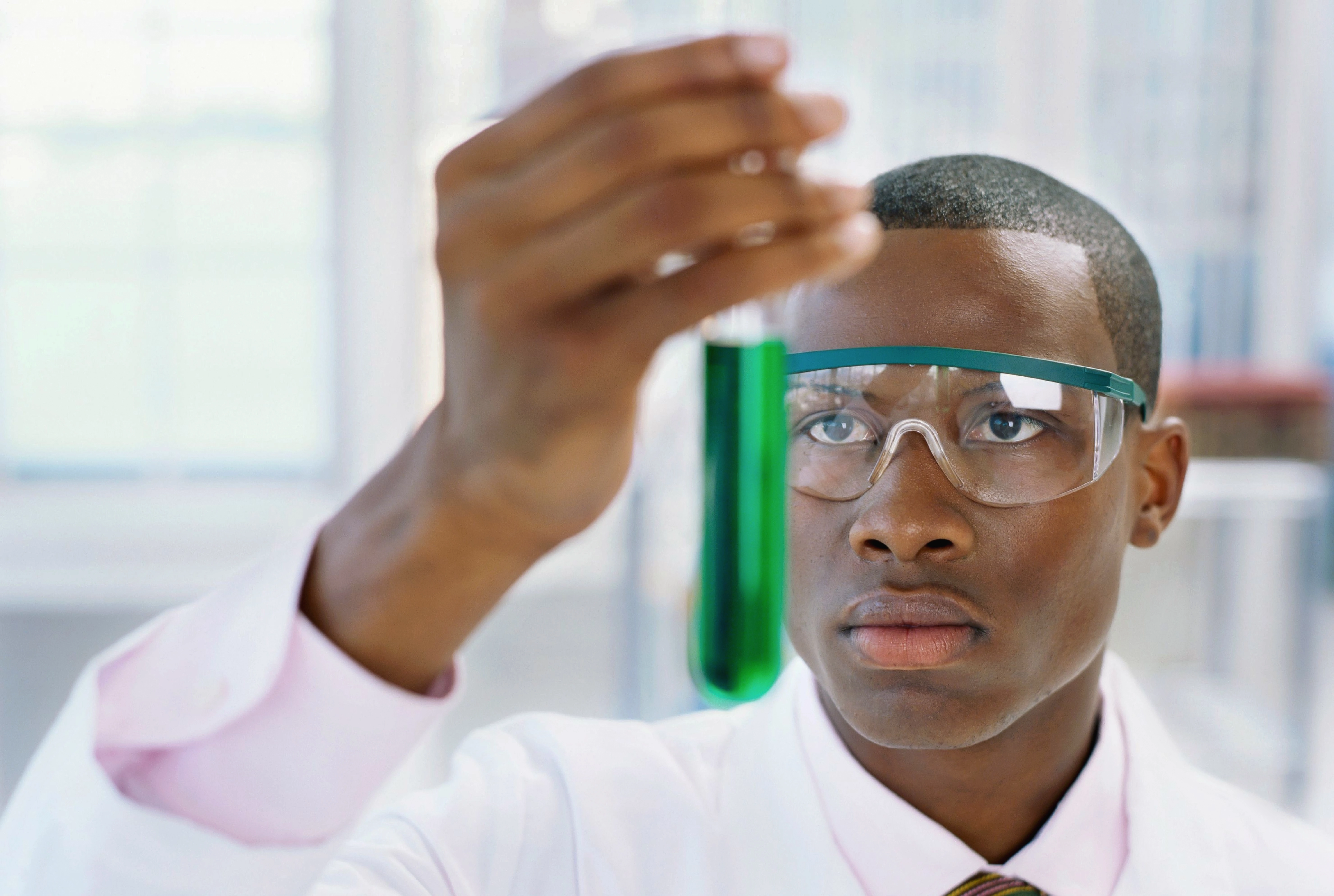 Black Scientist Holding Test Tubes with Chemicals meme template
