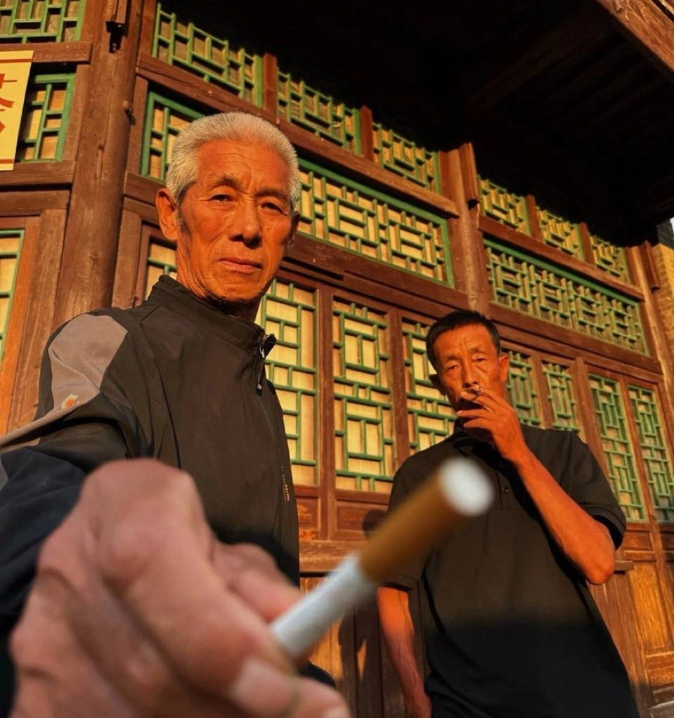 Chinese Man Offering Cigarette meme template