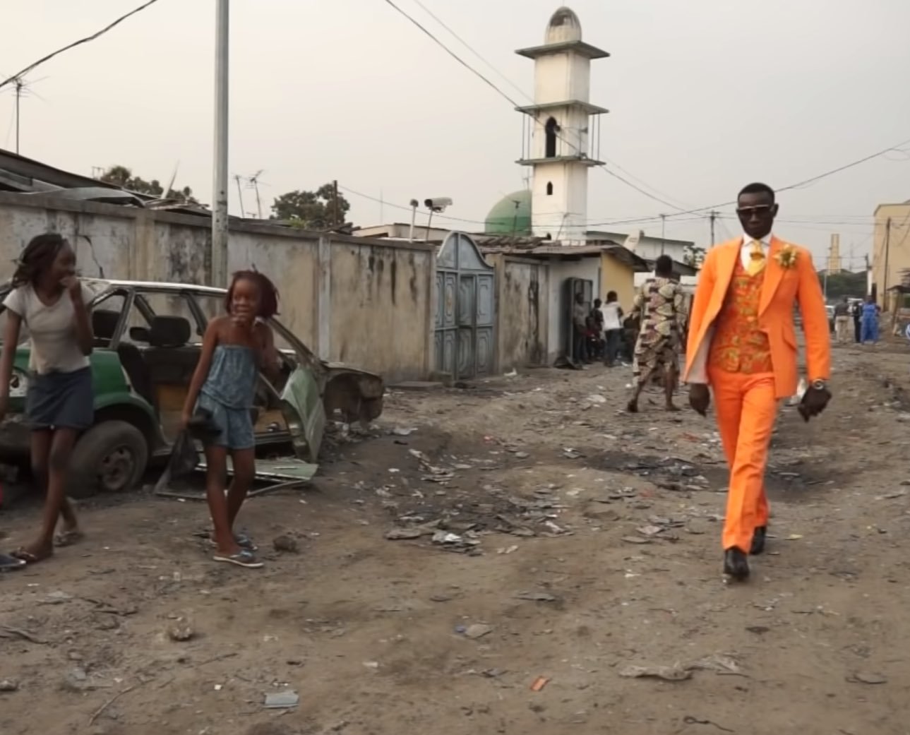 Guy with Fresh Bright Orange Suit in Slums meme template